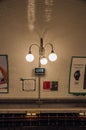 Close-up of luminaires in the Cite subway station platform in Paris.